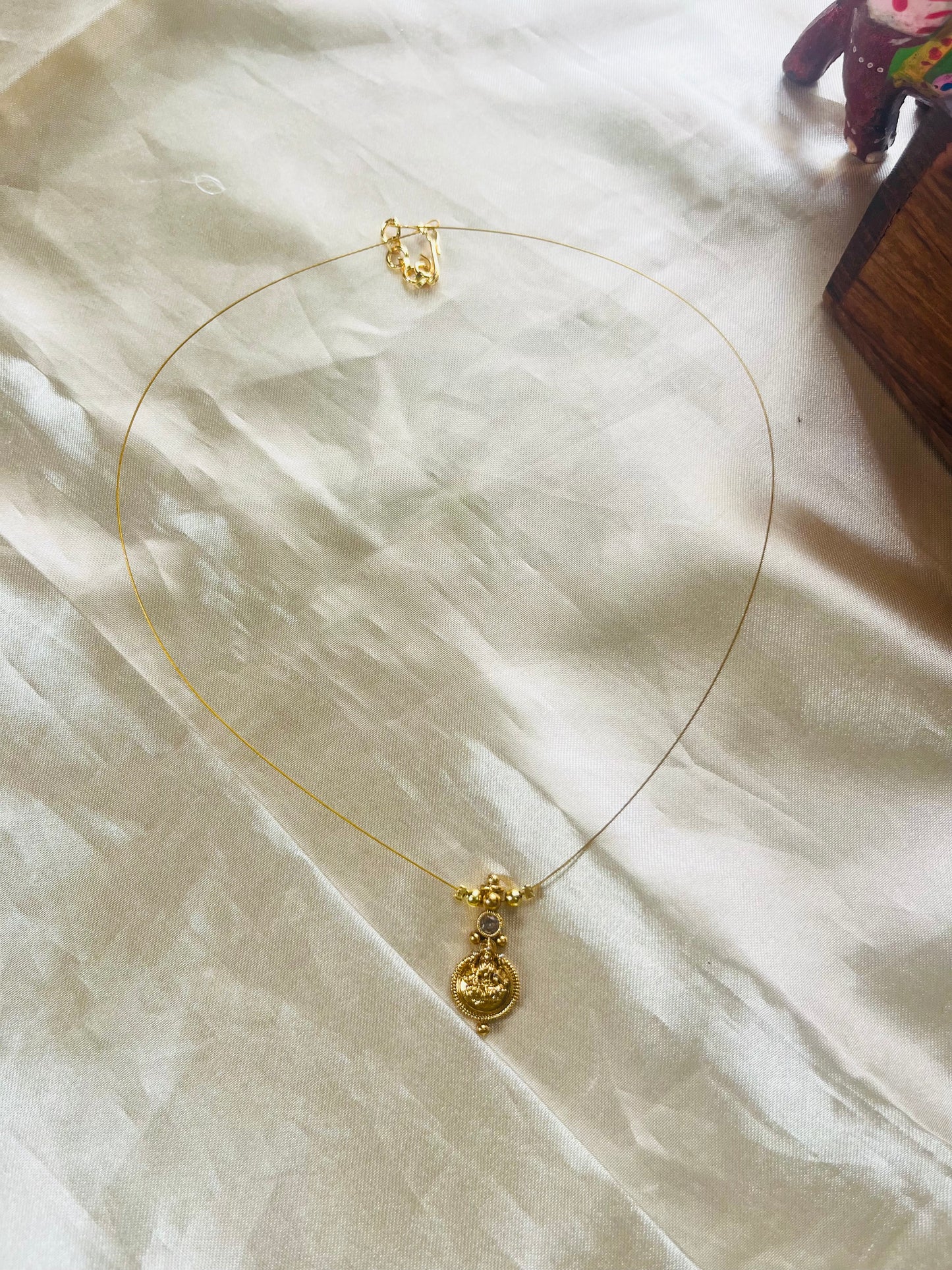 Lakshmi coin invisible necklace